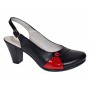 Pantofi eleganți de damă, tip slingback, cu toc gros stabil și design modern în combinație negru-roșu. Ideali pentru ținute office sau casual.